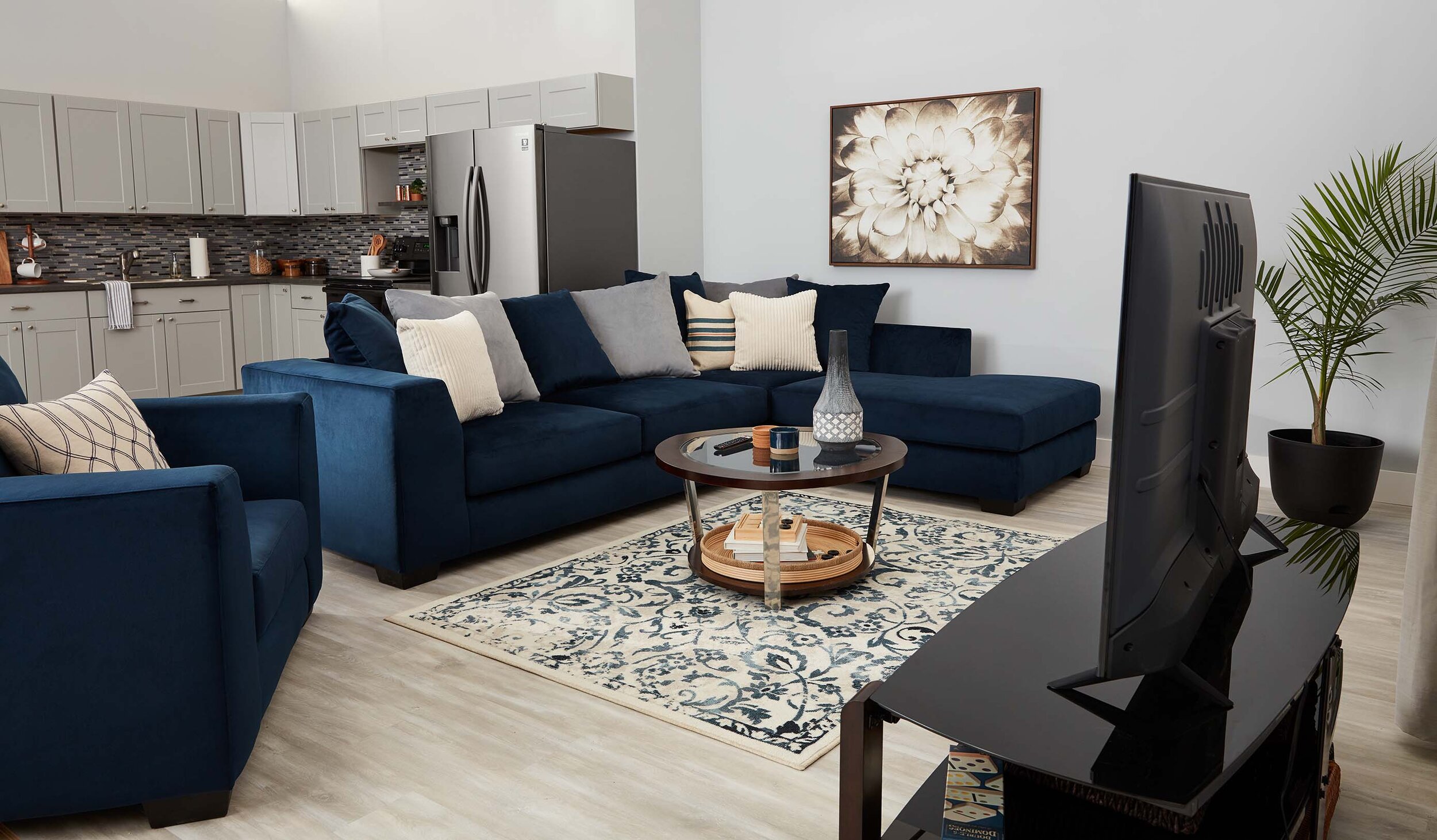 https://blog.aarons.com/wp-content/uploads/2021/07/aarons-living-room-area-rug-placement.jpg